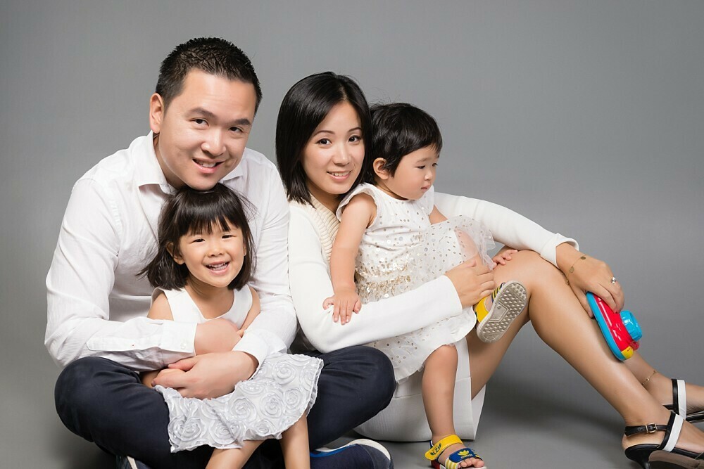 Family with 2 daughters in studio photoshoot