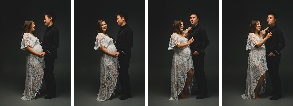 Pregnant couple standing in Sydney studio on dark grey background