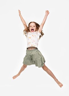 Girl jumping in Coogee Kids photo session with white studio background