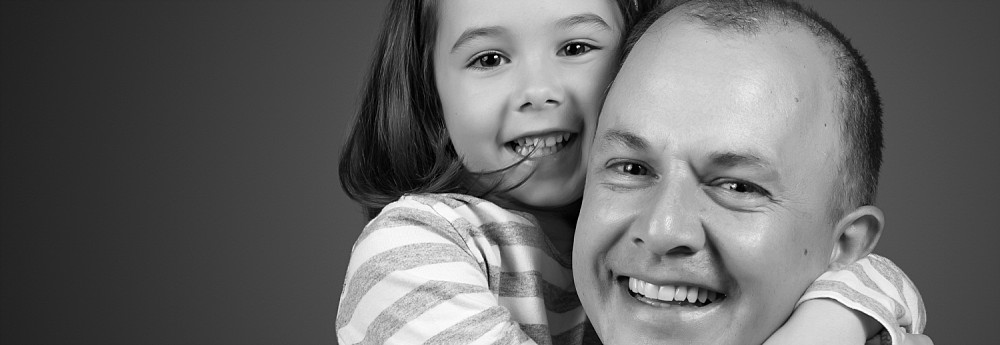5 year old girl hugging dad at Sydney studio photography session