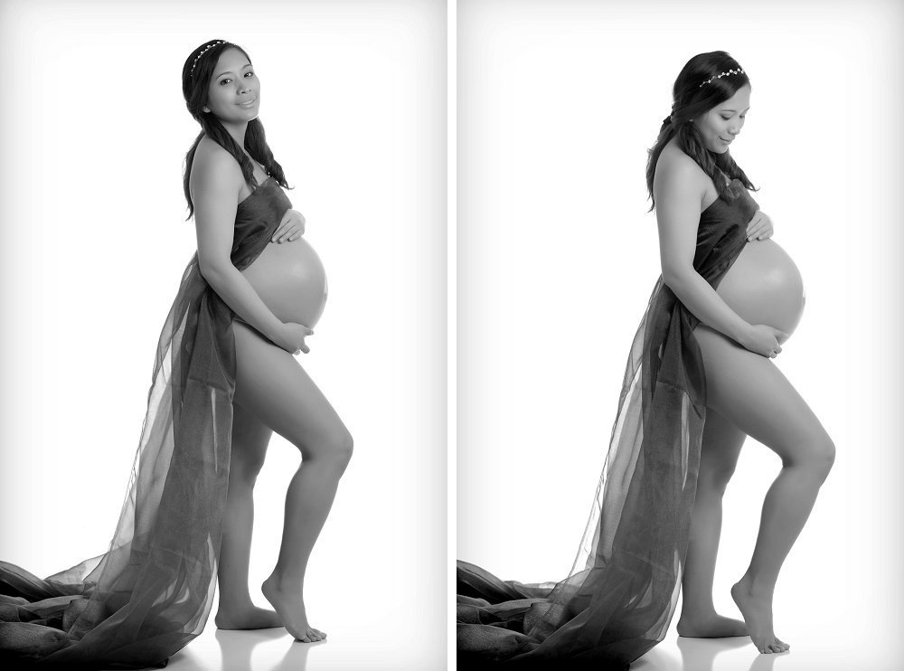Pregnant woman with sash and bare belly in studio