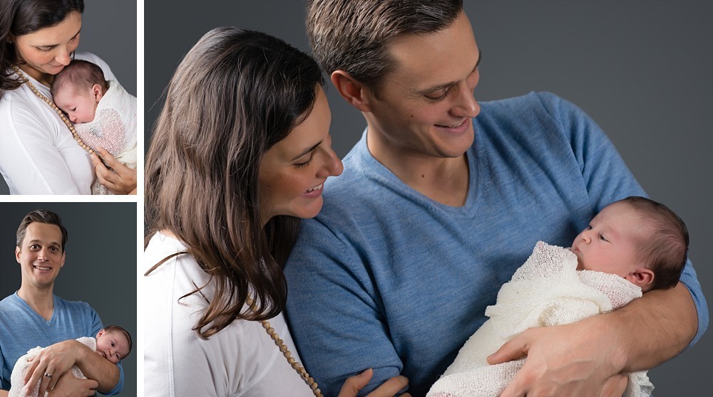 Caucasian parents and newborn baby girl in Sydney studio on grey background
