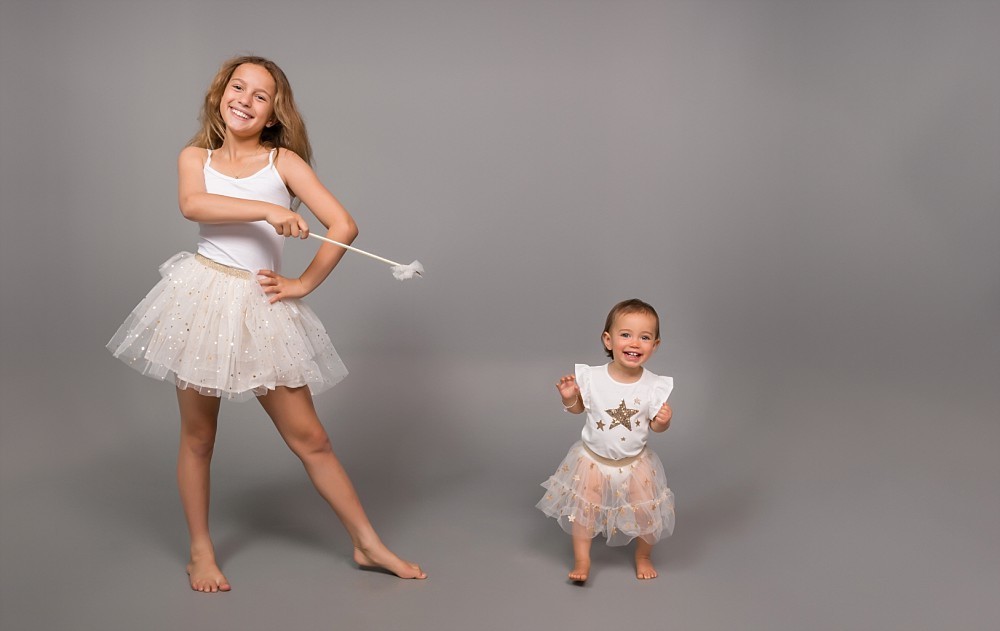 Two sisters in matching tulle dress and fairy wand in Sydney Eastern Suburbs photography studio