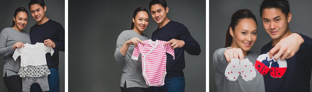 Pregnant couple showing baby items in studio in Sydney