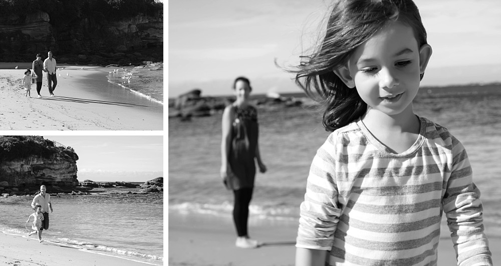 5 year old girl walking with mum and dad at Coogee Beach Sydney