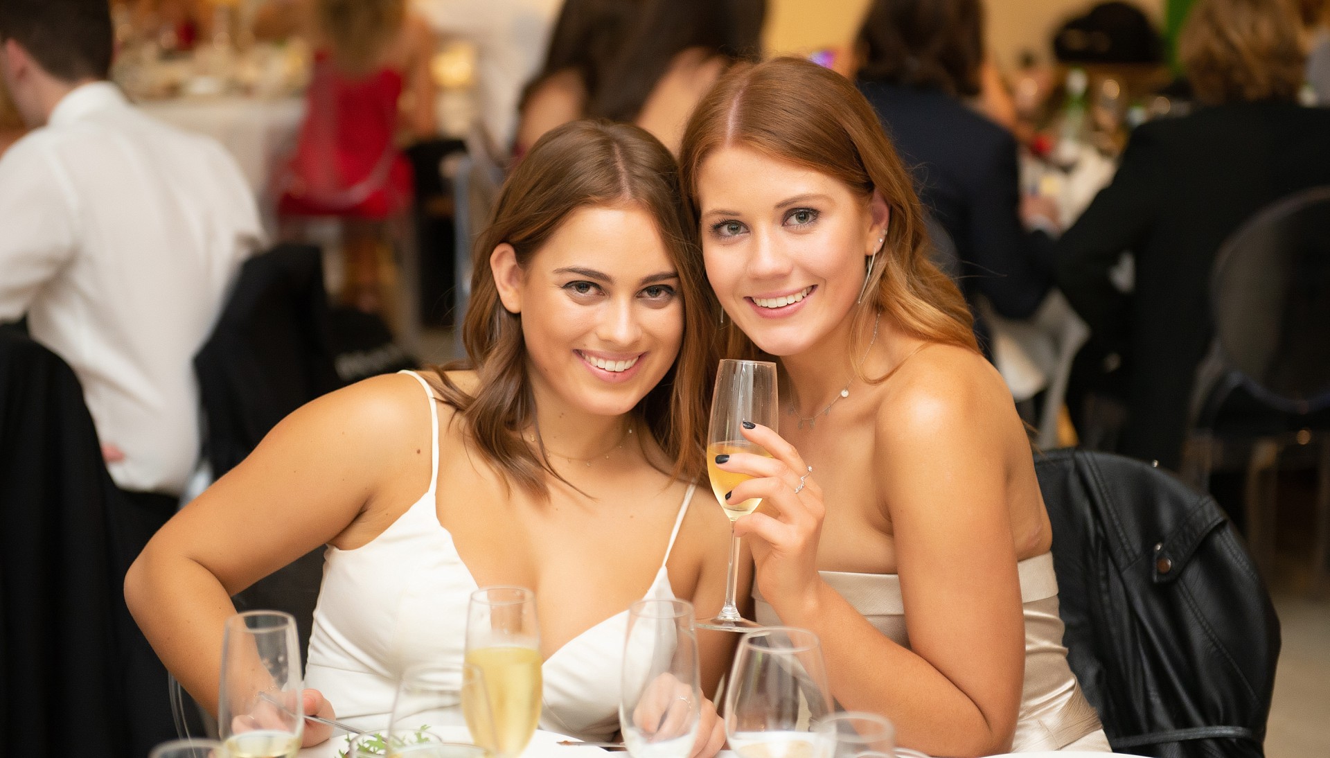 Guests at dinner party with champagne in Event Photography Sydney