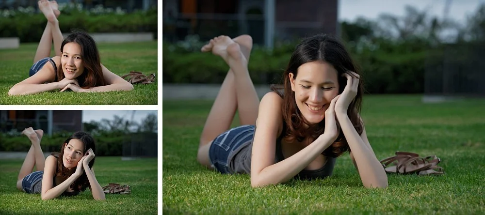 Young woman lying on grass feet up in air