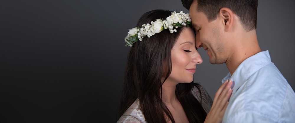 Loving couple with flower crown in Sydney studio