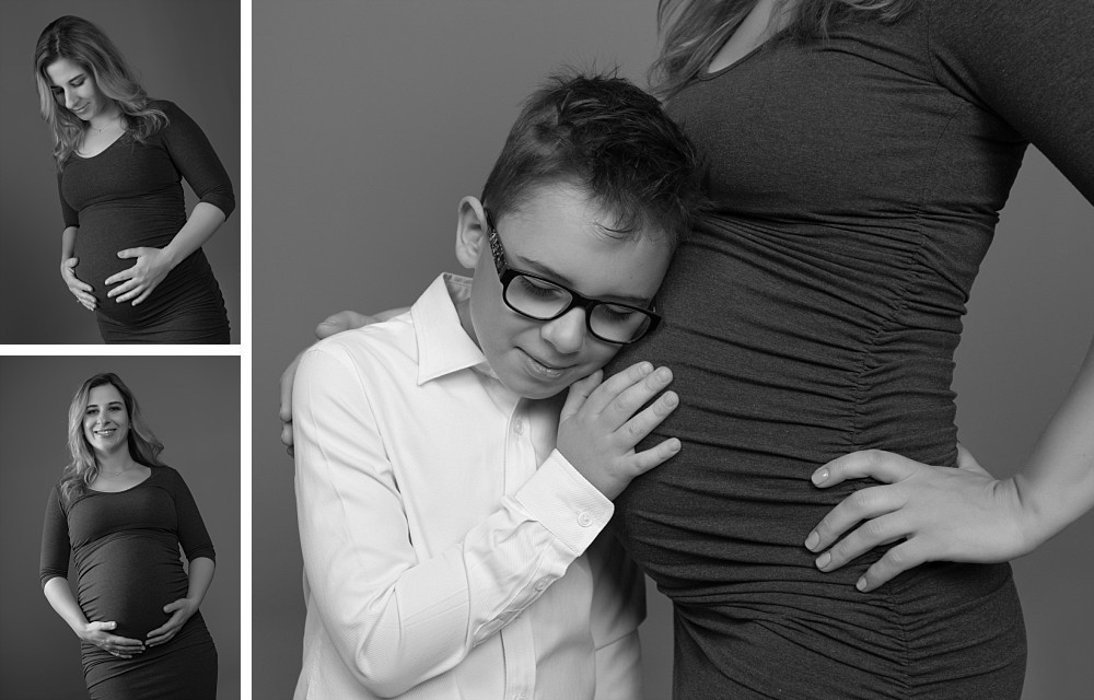 Young boy with glasses listening to belly, pregnant woman in Sydney studio